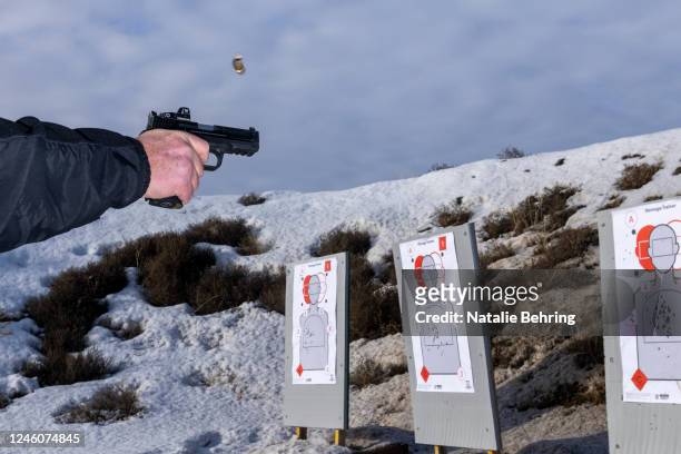 Bullet casing flies as a student practices shooting a Glock pistol at a concealed carry permit class on January 7, 2023 in Rexburg, Idaho. The state...