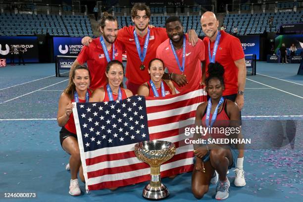 Team US celebrates with the winning trophy of the United Cup after their finals against Italy in Sydney on January 8, 2023. - -- IMAGE RESTRICTED TO...