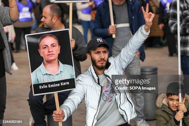 Protester makes a V sign for victory during the demonstration. The Kurdish community of France gathered to pay a tribute to the three PKK militants...