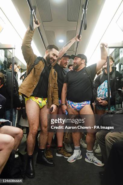 People riding the tube as they take part in the 12th annual No Trousers Tube Ride in London. Picture date: Sunday January 8, 2023.