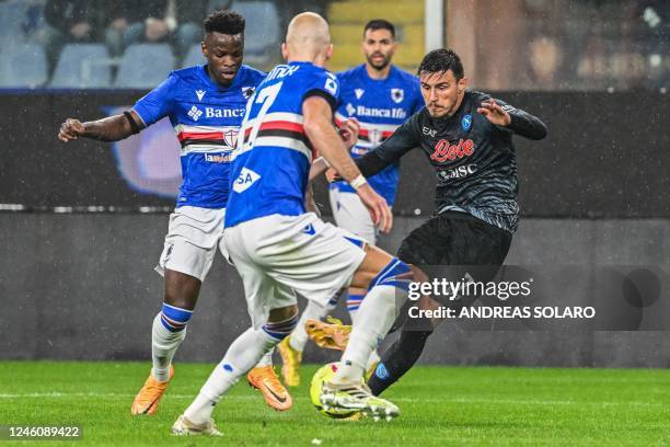 Napoli's Macedonian midfielder Eljif Elmas challenges Sampdoria's Colombian defender Jeison Murillo and Napoli's Uruguayan defender Mathias Olivera...