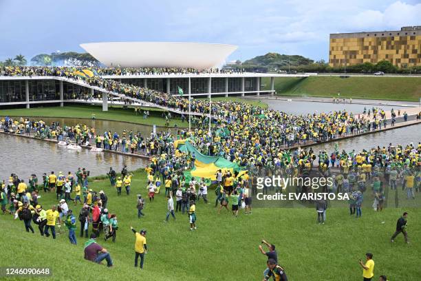 Supporters of Brazilian former President Jair Bolsonaro hold a demonstration at the Esplanada dos Ministerios in Brasilia on January 8, 2023. -...