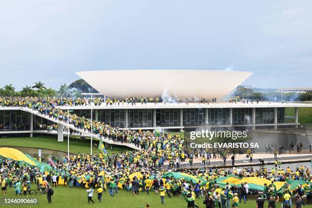 Supporters of Brazilian former President Jair Bolsonaro hold a demonstration at the Esplanada dos Ministerios in Brasilia on January 8, 2023. -...