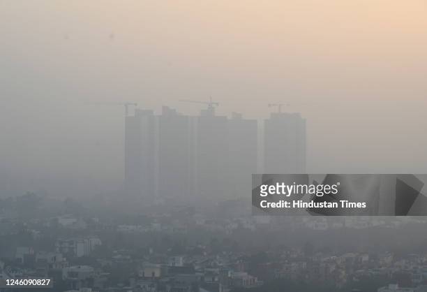 View of skyscraper engulfed in dense smog amid rising air pollution levels, on January 7, 2023 in Noida, India.