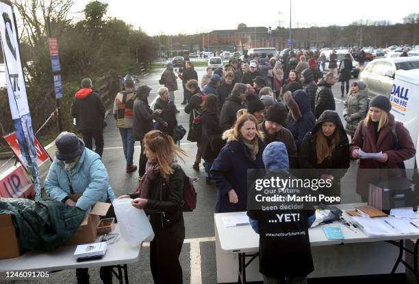 Volunteers queue up to collect leaflets and a city centre map of a ward to deliver to as 'Not Our Future' campaign to stop Oxford's smart city begins...