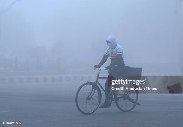 Delhiites brave the early morning heavy Fog and Winter Chill, at Dwarka, on January 8, 2023 in New Delhi, India. The IMD in Delhi said the minimum...