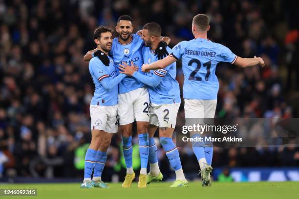 Riyad Mahrez of Manchester City celebrates scoring the opening goal with Bernardo Silva, Kyle Walker and Sergio Gomez during the Emirates FA Cup...