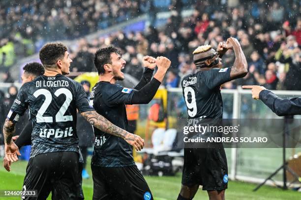 Napoli's Macedonian midfielder Eljif Elmas celebrates with Napoli's Italian defender Giovanni Di Lorenzo and Napoli's Nigerian forward Victor Osimhen...