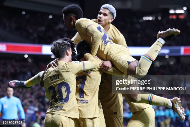 Barcelona's players celebrate their opening goal scored by Barcelona's French forward Ousmane Dembele during the Spanish League football match...