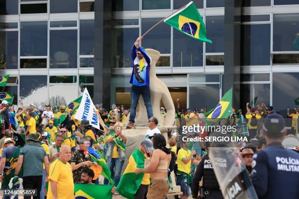 Supporters of Brazilian former President Jair Bolsonaro invade Planalto Presidential Palace while clashing with security forces in Brasilia on...