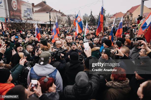 Far-right leader of People's Party Our Slovakia, Marian Kotleba attends as people holding flags gather at the main square of the town during a...