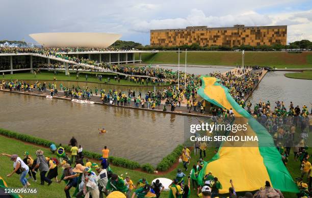 Supporters of Brazilian former President Jair Bolsonaro invade the National Congress in Brasilia on January 8, 2023. - Hundreds of supporters of...