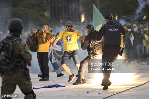 Supporters of former President Jair Bolsonaro supporters clash with security forces as they raid the National Congress in Brasilia, Brazil, 08...
