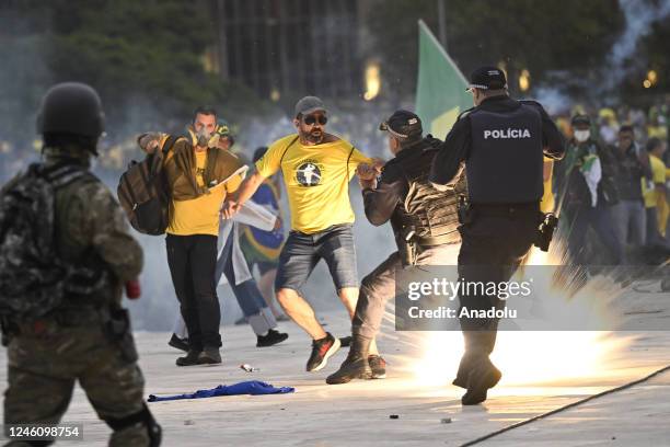 Supporters of former President Jair Bolsonaro supporters clash with security forces as they raid the National Congress in Brasilia, Brazil, 08...