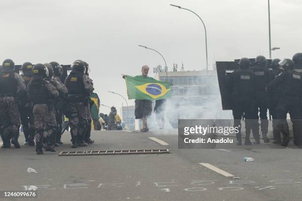 Supporters of former President Jair Bolsonaro clash with security forces as they raid the National Congress in Brasilia, Brazil, 08 January 2023....