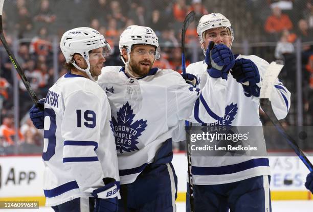 Timothy Liljegren of the Toronto Maple Leafs celebrates his second period goal against the Philadelphia Flyers with Calle Jarnkrok and Justin Holl at...