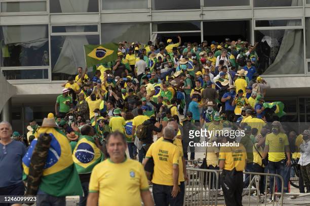 Supporters of former President Jair Bolsonaro clash with security forces as they raid governmental buildings in Brasilia, Brazil, 08 January 2023....