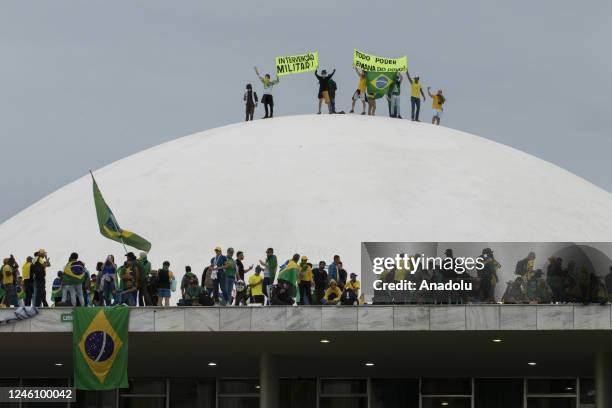 Supporters of former President Jair Bolsonaro clash with security forces as they raid the National Congress in Brasilia, Brazil, 08 January 2023....