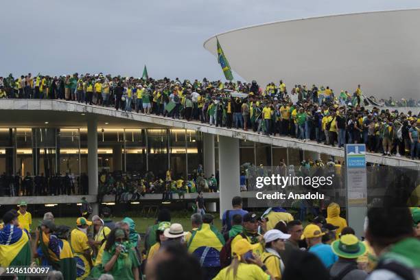 Supporters of former President Jair Bolsonaro clash with security forces as they raid the National Congress in Brasilia, Brazil, 08 January 2023....