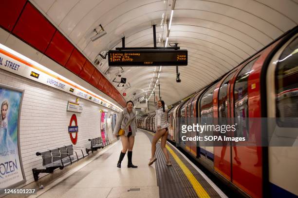 Two participants of the "No Trousers Tube Ride" are seen without wearing trousers inside London underground station. "No Trousers Tube Ride" returned...