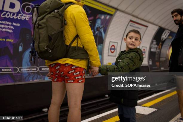 Participant of the "No Trousers Tube Ride" brings his son to participate the event. "No Trousers Tube Ride" returned to London since it was held in...