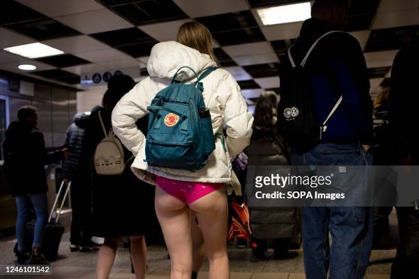Participant of the "No Trousers Tube Ride" is seen walking inside the London Underground station. "No Trousers Tube Ride" returned to London since it...