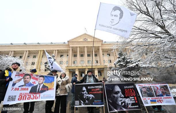 Supporters of Georgia's ex-president Mikheil Saakashvili rally outside the Tbilisi court during a hearing to consider a request from Saakashvili's...