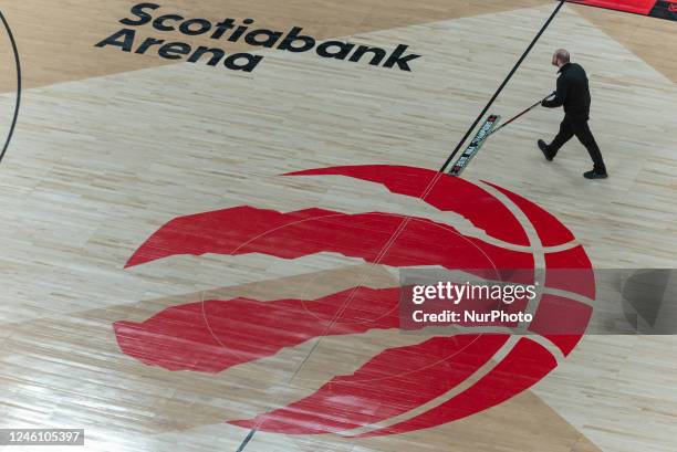 January 8, 2023: Man mopping the floor during timeout during the Toronto Raptors v Portland Trail Blazers NBA regular season game at Scotiabank Arena...