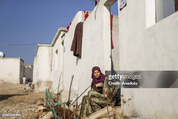 Woman is seen in front of a briquette house, delivered to her family by Human Movie Team and IHH Humanitarian Relief Foundation in Sharran town of...