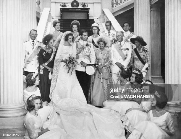 King Constantine II of Greece and Queen Anne Marie on their wedding day in Athens on September 18, 1964 pose for photos with bridal maids , King...