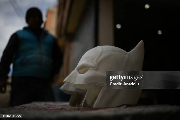 Batman masks being created in the workshop of sculptor Ramiro Sirpa in La Paz, Bolivia on December 22, 2022. Ramiro Sirpa known as "the sculptor of...