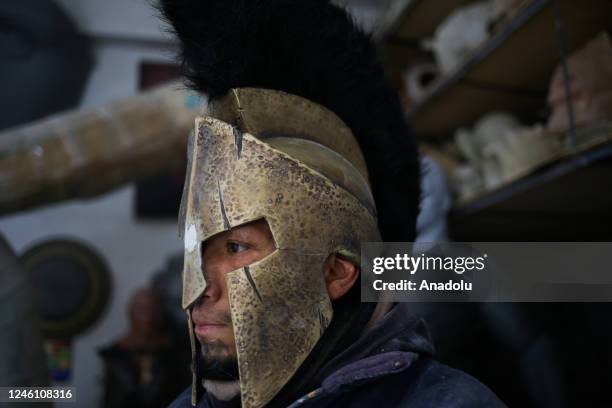 Sculptor Ramiro Sirpa tries on a spartan helmet made of fiberglass inspired by the movie 300 in La Paz, Bolivia on December 22, 2022. Ramiro Sirpa...