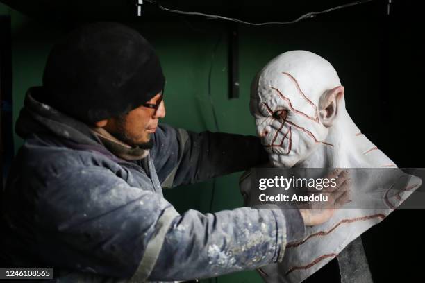 Sculptor Ramiro Sirpa looks at his sculpture of the Azog character made in his workshop in La Paz, Bolivia on December 22, 2022. Ramiro Sirpa known...