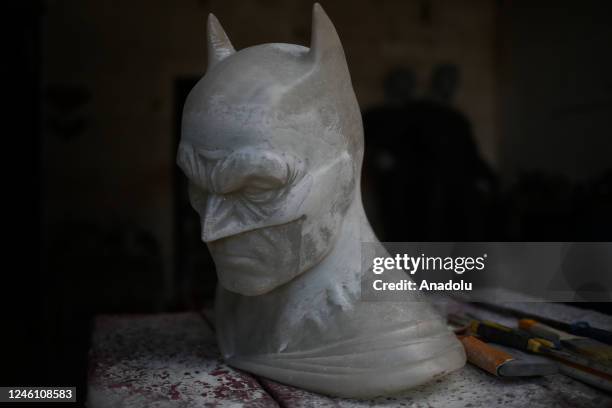Bust of Batman in progress is worked on in the workshop of sculptor Ramiro Sirpa in La Paz, Bolivia on December 22, 2022. Ramiro Sirpa known as "the...