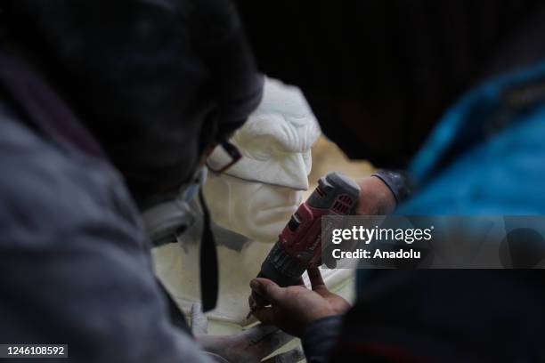 Sculptor Ramiro Sirpa works on polishing and molding a Batman bust at his workshop in La Paz, Bolivia on December 22, 2022. Ramiro Sirpa known as...