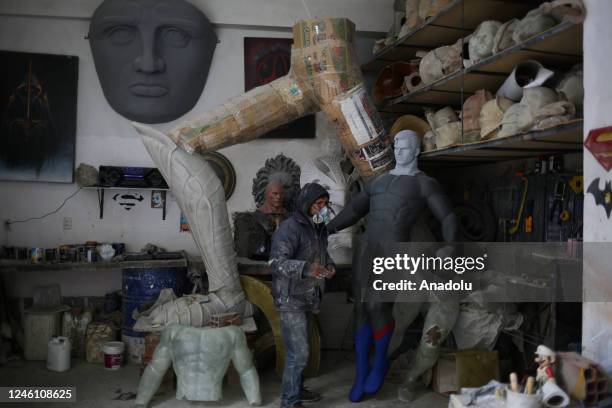 Sculptor Ramiro Sirpa walks inside his workshop in La Paz, Bolivia on December 22, 2022. Ramiro Sirpa known as "the sculptor of giants" is an artist...