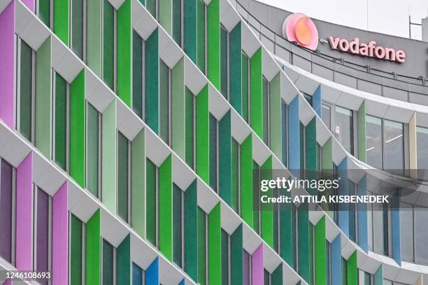 The logo of mobile operator Vodafone is seen at the company's headquarters in Budapest on January 9, 2022. - Vodafone announced on January 9 to sell...