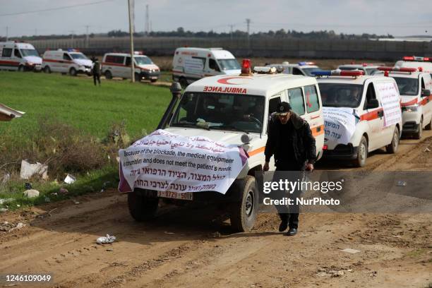 Convoy of Palestinian ambulance vehicles moves along the border fence between Israel and the Gaza Strip east of Gaza City during a protest against...