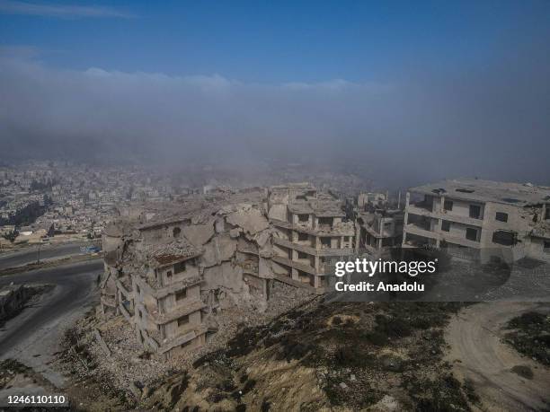 An aerial view of buildings turned into ruins after the attacks of forces affiliated with Assad Regime on a foggy day on Jabal al-Arba'in Mount on...