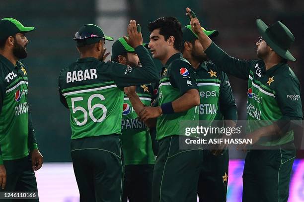 Pakistan's players celebrate after the dismissal of New Zealand's Michael Bracewell during the first one-day international cricket match between...