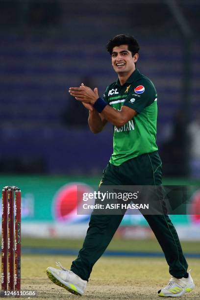 Pakistan's Naseem Shah celebrates after taking the wicket of New Zealand's Glenn Phillips during the first one-day international cricket match...