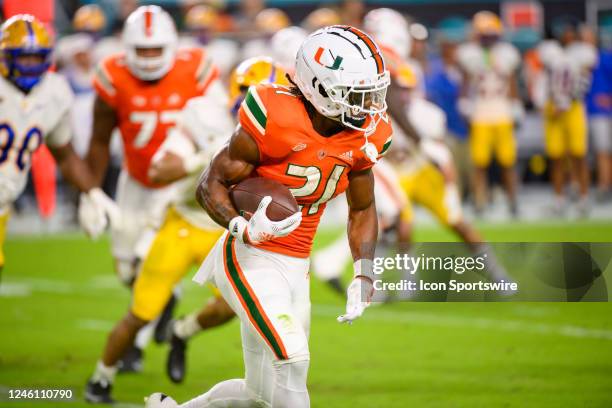 Miami Running Back Henry Parrish, Jr. Runs with the ball during an college football game between the Pittsburgh Panthers and the University of Miami...
