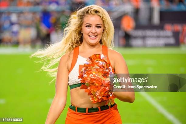 Miami cheerleader performs on the field before an college football game between the Pittsburgh Panthers and the University of Miami Hurricanes on...