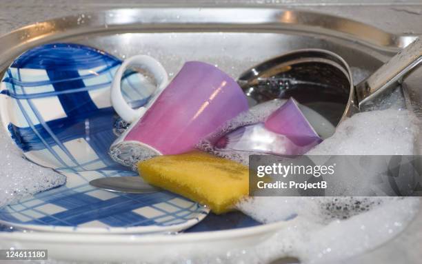 washing up in the sink - dirty pan stock pictures, royalty-free photos & images