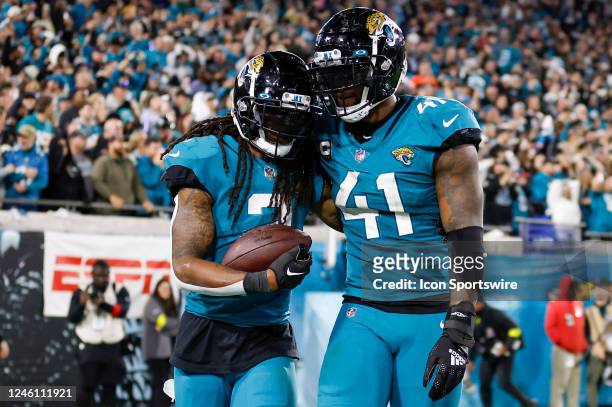 Jacksonville Jaguars safety Rayshawn Jenkins and Jacksonville Jaguars linebacker Josh Allen celebrate after a touchdown during the game between the...