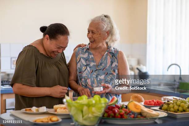 cooking together - minority groups stock pictures, royalty-free photos & images