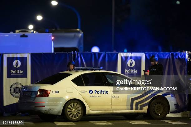 Policeman pictured at the scene of a shooting incident in the Nieuwdreef street in Merksem, Antwerp, where a person died on the evening of Monday 09...