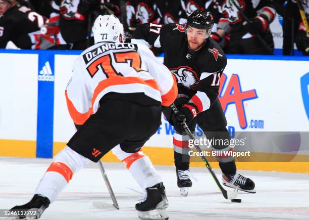 Tyson Jost of the Buffalo Sabres controls the puck as Tony DeAngelo of the Philadelphia Flyers defends during an NHL game on January 9, 2023 at...