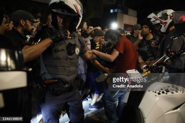 Man with a revolver taken into custody as he threatens protesters at Avenida Paulista in defense of democracy in Sao Paulo, Brazil, on January 9 a...