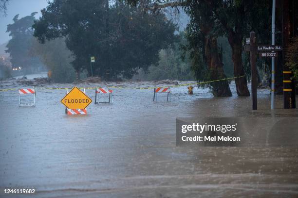 Jameson Lane in Montecito is flooded out, a result of San Ysidro creek overflowing due to heavy rainfall in the area. At left is the 101 freeway that...